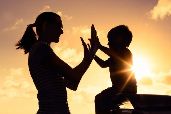 Image of happy mother and child after resolving child arrangements Epsom